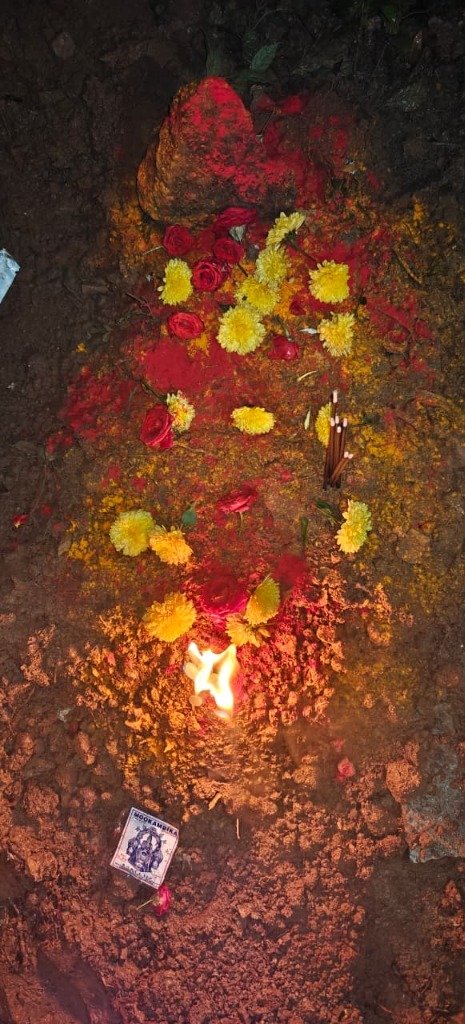 Night flame ritual at pet grave — traditional Hindu post-burial ritual Bengaluru